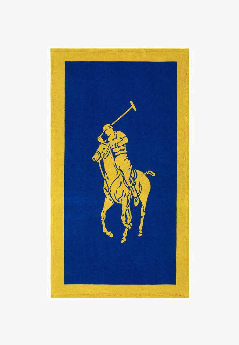 Μπλε ορθογώνιο χαλάκι με κίτρινο περίγραμμα, που απεικονίζει μια κίτρινη σιλουέτα παίκτη πόλο σε άλογο που κουνάει ένα μπαστούνι.