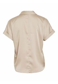 Blusa corta a maniche corte beige chiaro con colletto, realizzata in tessuto morbido. Presenta una linea dritta e maniche arrotolate.