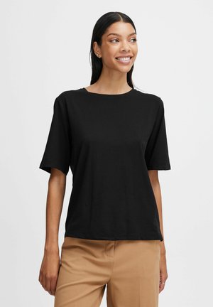 T-shirt nero a maniche corte con scollo rotondo, realizzato in tessuto morbido. Presenta una vestibilità rilassata e una trama liscia. Design semplice, senza motivi.