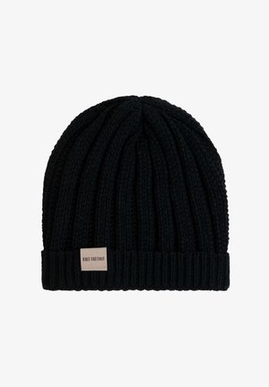 Bonnet en tricot noir avec une texture côtelée et un revers replié. Comprend une petite étiquette en cuir avec "KNIT FACTORY" sur le devant.