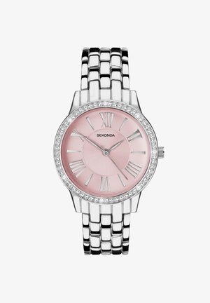 Montre en acier inoxydable argenté avec un cadran rose, des chiffres romains et une lunette accentuée de cristaux. Le bracelet présente un design élégant et entrelacé.