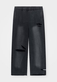 Črne kavbojke iz jeansa z elastičnim pasom, z okvarjenimi detajli, vključno z raztrganinami in luknjami, ter stranskimi žepi za priročnost.