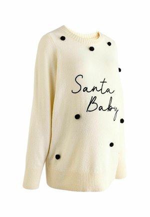 Kreemikaalune sviiter ribadega mansettidega, millel on mustad pom-pomid ja musta kutsuva kirjaga tikand "Santa Baby" esiküljel.