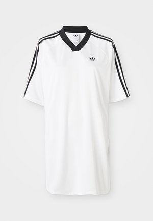 Hvit kortermet sportstrøye med svart V-hals og svarte tre-stripes detaljer på skuldrene. Har en liten logo på brystet.