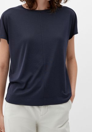 Mörkblå kortärmad topp med avslappnad passform, tillverkad av textil med textur. Har rund halsringning och rak nederkant.