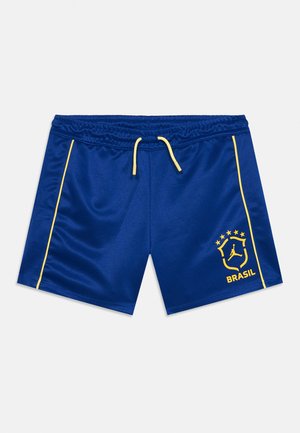 Mėlyni sportiniai šortai su geltonu raišteliu, šoninėmis juostelėmis ir geltonu „Brasil“ logotipu su žvaigždėmis ir stilizuota figūra dešinėje kojoje.