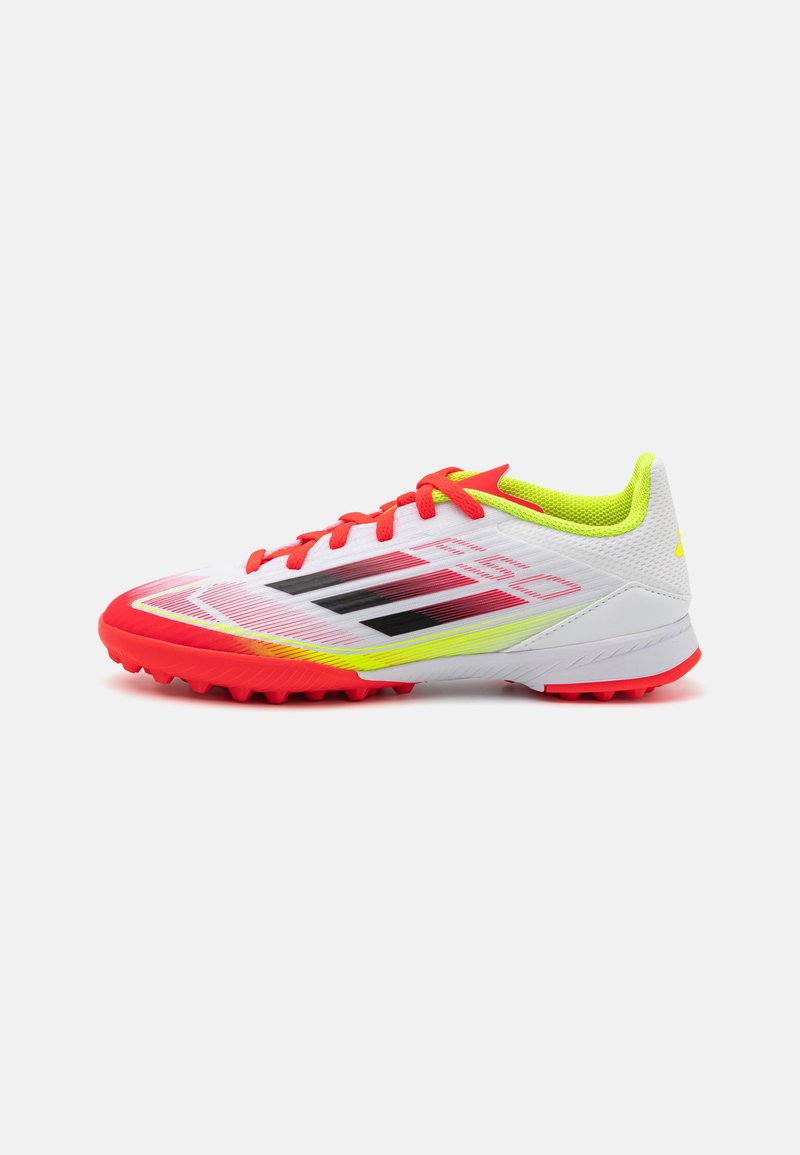 Football shoes with a white textile upper, red accents, black stripes, and a vibrant yellow collar. Features a textured sole for grip.