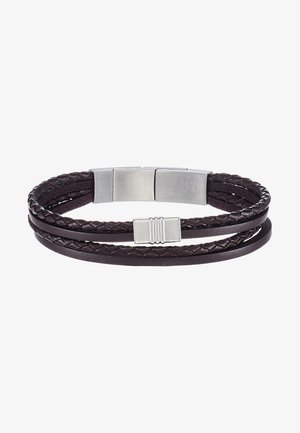 Spleciona brązowa skórzana bransoletka z metalowym zapięciem w kolorze srebrnym, składająca się z dwóch pasm: jednego gładkiego i jednego o plecionym wzorze. Długość i dopasowanie regulowane.