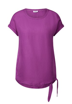 Lilla kortærmet top med oprollende manchetter, rund halsudskæring og en knudepunkt på den ene side. Fremstillet af glat, let stof.
