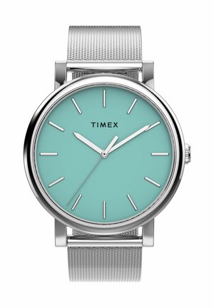 Orologio con cinturino in maglia d'argento e quadrante turchese, indicatori delle ore e lancette argentate con orario 10:09:10, nome del marchio Timex sul quadrante.