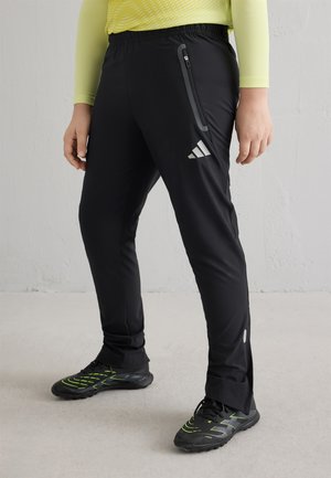 adidas Performance ARSENAL FC TIRO25 COMPETITION TRAVEL PANT KID UNISEX - Pantalones deportivos - black