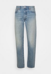 Ljusblå denimjeans med rak passform, blekt mönster, femfickorsdesign och metallknappstängning. Har lätt slitage på tyget.