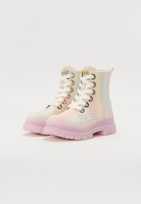 High-top boots made of iridescent material with a pink rubber sole, white laces, and metal eyelets, featuring logo accents on the tongue.
