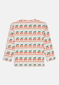 Long-sleeve cream shirt with repeating horizontal rows of red cherries and green leaves pattern.