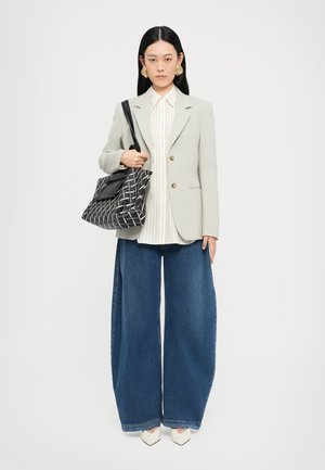 Light gray blazer, white striped shirt, wide-leg blue jeans, pattern bag, and white pointed heels. Sleek design with gold accents.