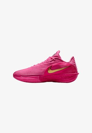 Roze sportschoen met geribbelde bovenkant, gouden Nike swoosh, gestructureerde hiel en gespikkelde middenzool. Voorzien van veters en een gevoerde tong.