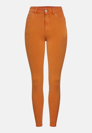 Orange high-waisted skinny jeans made from smooth cotton blend, featuring a button closure and standard five-pocket design.