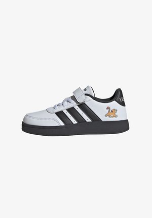 Scarpa da ginnastica bianca con strisce nere, chiusura a strappo e dettaglio con lacci. Presenta una grafica di un leone sul lato e una suola nera testurizzata.