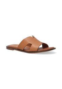 Tan leather slide sandal featuring a two-strap design with cutout details, flat sole, and a smooth finish.