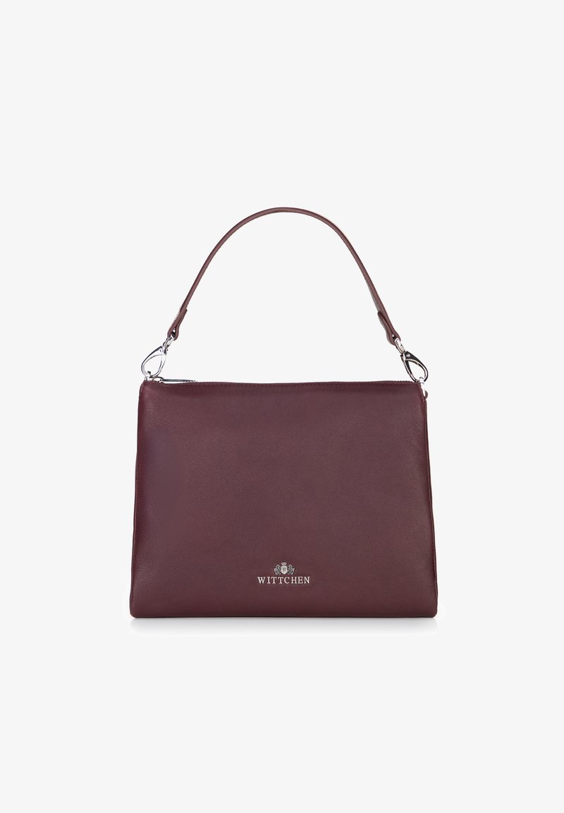 Borse in pelle bordeaux con manico singolo, zip argentata e logo in metallo "Wittchen" sul davanti.