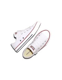Pair of white low-top Converse sneakers with red and blue stripe detailing and Velcro straps on a white background.