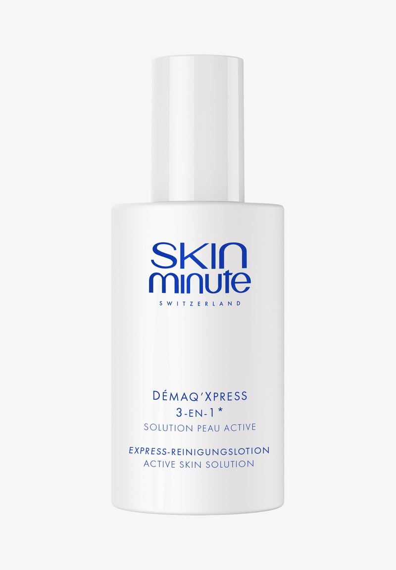 Bouteille blanche de Skin Minute Switzerland Démaq’Xpress 3-en-1 solution active pour la peau, lotion nettoyante express avec texte bleu.