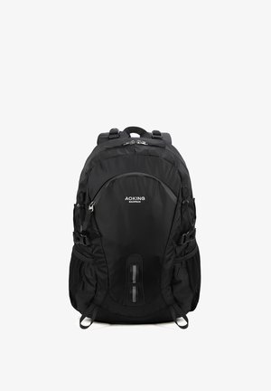 Zaino nero realizzato in tessuto resistente, dotato di spallacci imbottiti, numerosi scomparti e fibbie laterali regolabili.