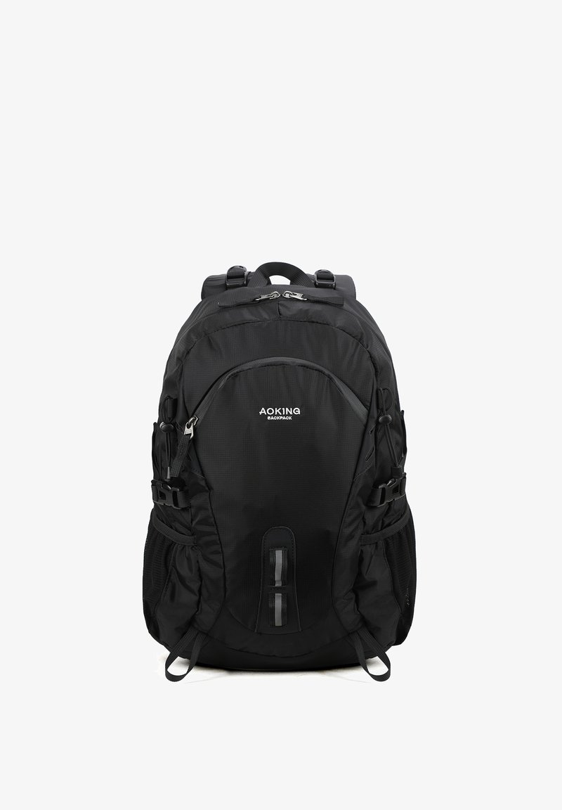 Zaino nero realizzato in tessuto resistente, dotato di spallacci imbottiti, numerosi scomparti e fibbie laterali regolabili.