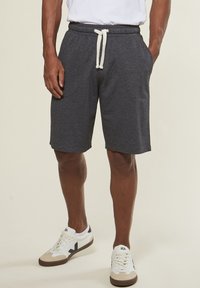 Gray cotton blend bermuda shorts with an elastic waistband and white drawstring, featuring side pockets and a relaxed fit.