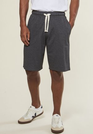 Graue Baumwollmischung-Bermudashorts mit einem elastischen Bund und weißem Kordelzug, ausgestattet mit seitlichen Taschen und einem lockeren Schnitt.