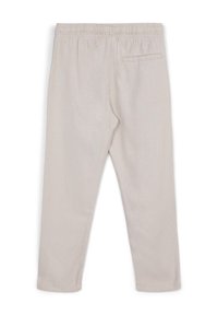 Hellbeige, elastische Hosen mit geradem Bein, die über eine einzelne Gesäßtasche verfügen und aus einem weichen, strukturierten Stoff gefertigt sind.