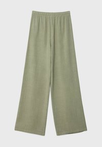 Pantalons larges vert clair en tissu doux, dotés d'une taille élastique. La texture semble lisse avec un design minimaliste.
