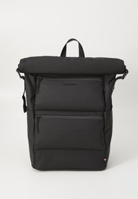 Black roll-top backpack made of smooth fabric, featuring three zippered pockets and a logo accent. The design includes adjustable straps.