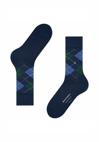 Calcetines azul oscuro con un patrón de argyle en tonos de azul y verde. Textura suave con contornos de diamante blancos y marca.