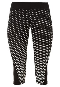 Leggings de sport à motif géométrique noir et blanc avec une large ceinture noire et une longueur raccourcie.
