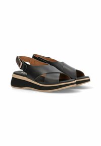 Sandalias de cuero negro con diseño de tiras cruzadas, puntas abiertas y una plantilla acolchada. Cuenta con suela de goma y cinta ajustable en el tobillo.