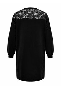 Top negro de manga larga con espalda de encaje. Tela suave, corte holgado y puños elásticos. El encaje presenta patrones florales alrededor del escote.