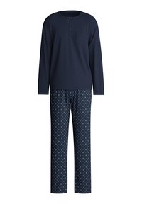 Navyblaues Langarm-Pyjama-Oberteil mit Tasche und Knopfleiste, kombiniert mit gemusterten Hosen, die kleine geometrische Designs in Pink und Navy aufweisen.