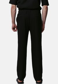 Justin Cassin ABADE  - Broek - black