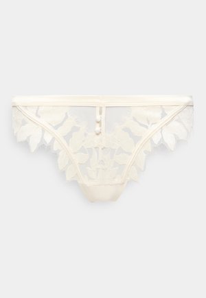 Weiße transparente Spitzenunterhose mit floraler Stickerei und zwei kleinen dekorativen Knöpfen an der Taille vorne in der Mitte.
