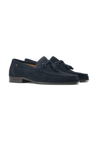 Navy suede loafers with a low profile, featuring a bow accent, stitch detailing, and subtle gold-tone hardware. Rubber sole for grip.