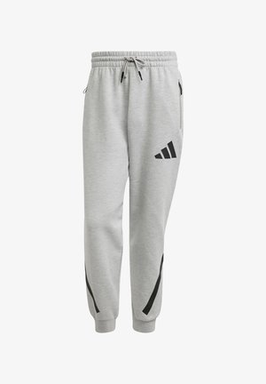 Gray sweatpants made of cotton with an elastic waistband, drawstring, side pockets, and black accent stripes along the sides. Black logo on the thigh.