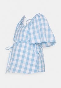 Top de xadrez gingham azul e branco com mangas puff, laço ajustável na cintura e decote quadrado. Feito de tecido de algodão leve.