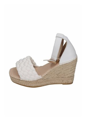 White wedge espadrille sandals with woven fabric upper, elastic ankle strap, and a jute-wrapped heel. Smooth texture and open design.