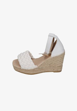 White wedge espadrille sandals with woven fabric upper, elastic ankle strap, and a jute-wrapped heel. Smooth texture and open design.