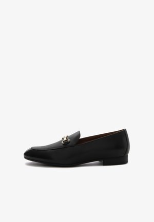 Black leather loafers with a shiny gold hardware accent. Features a rounded toe and low heel, showcasing a smooth texture and sleek design.