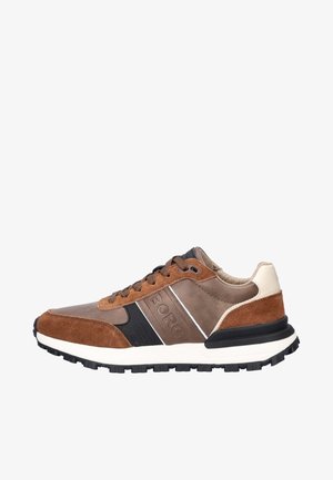 Brown suede and leather sneakers with a black outsole, featuring white accents, a cushioned collar, and textured sides for grip.