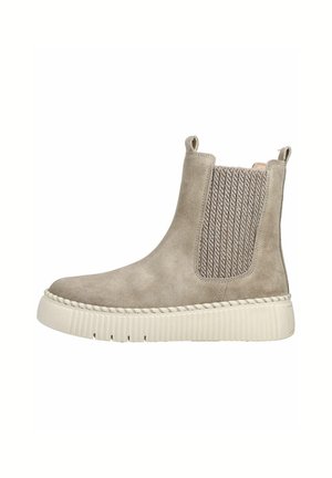 Lys beige ruskind støvle til anklen med tyk hvid gummisål og elastisk sidestykke med trækflapper foran og bagpå.