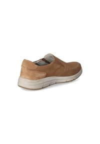 Tan suede slip-on shoe with a rounded toe, stitched detailing, and a contrasting beige rubber sole featuring a textured pattern.
