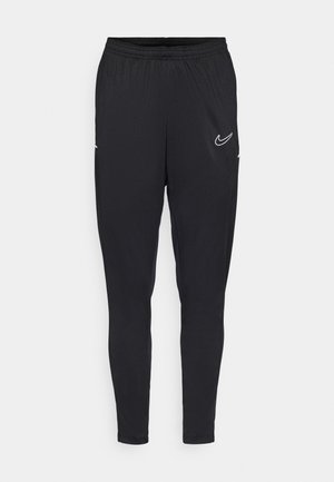 Musta urheiluhousut kapea malli, joustava vyötärö, sivutaskut ja valkoinen Nike-logo vasemmassa yläreunassa. Silkkinen kangas.
